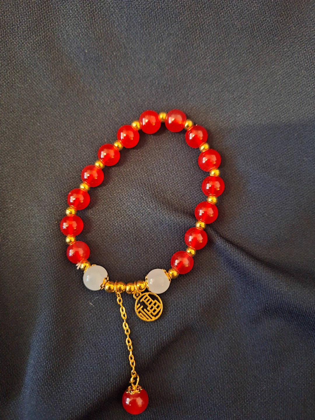 Red and White Beaded Bracelet with Gold Charm