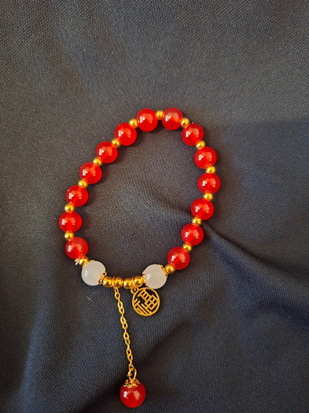 Red and White Beaded Bracelet with Gold Charm