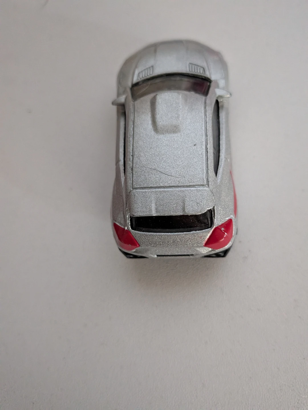 Silver Toy Car with Red Accents