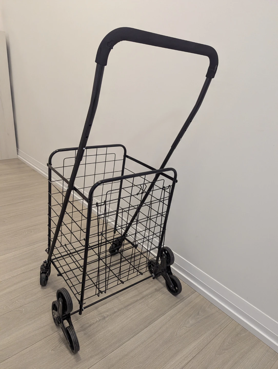 Black Metal Shopping Cart with Stair-Climbing Wheels