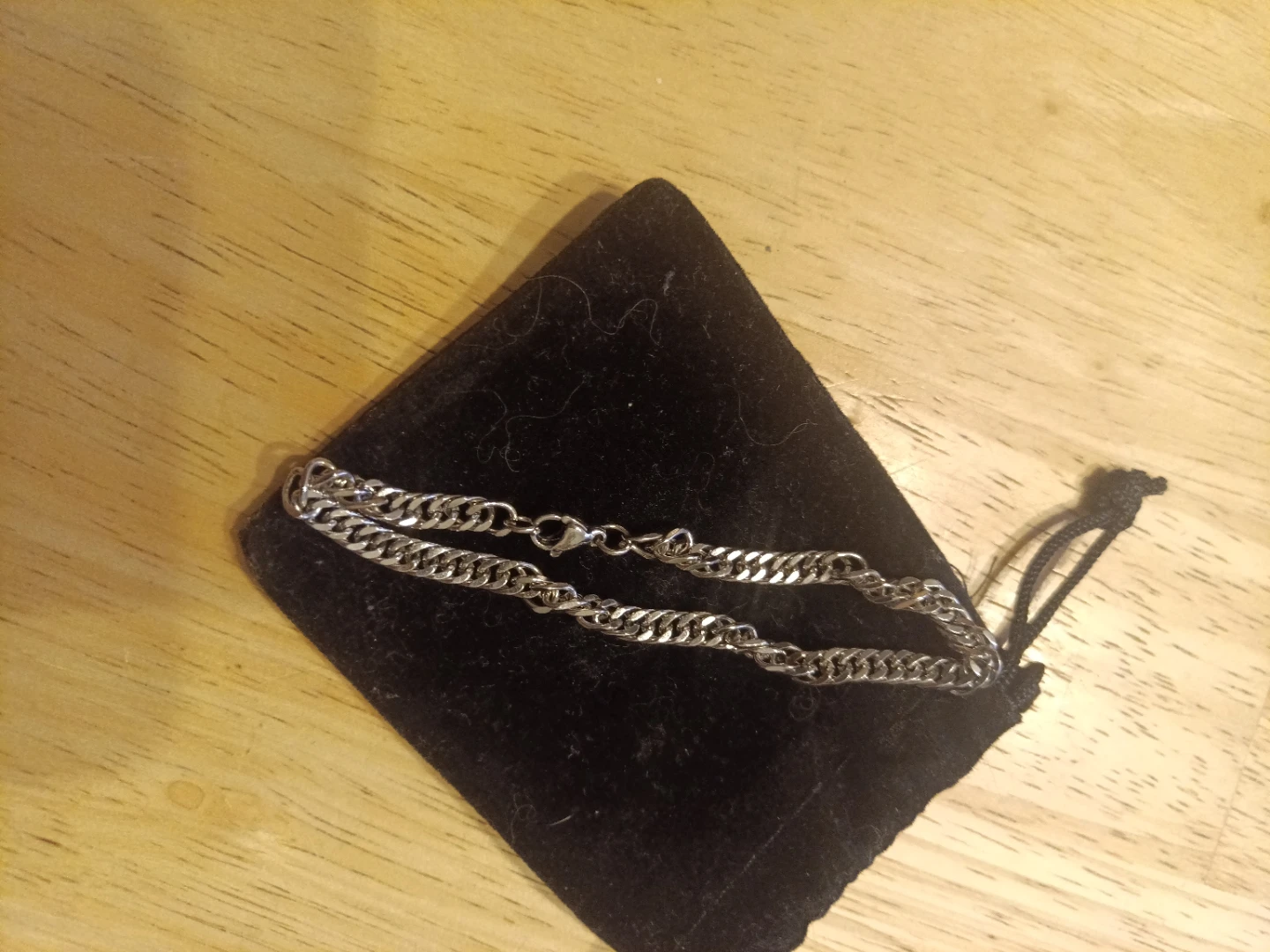 Multiple small silver bracelets