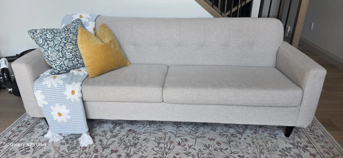 Beige Sofas and brown chairs