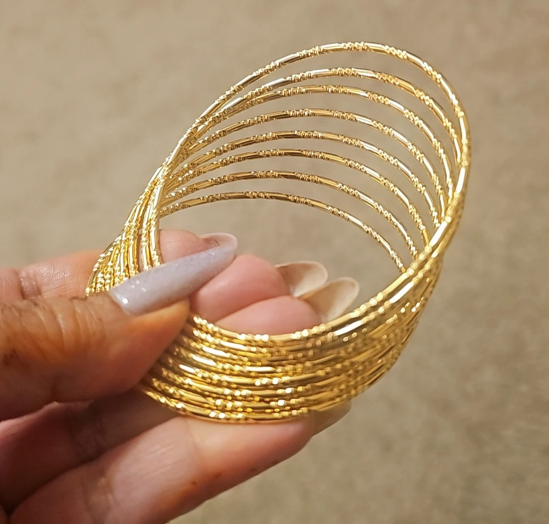 Set of 8 Bangles, 24 Karat gold plated