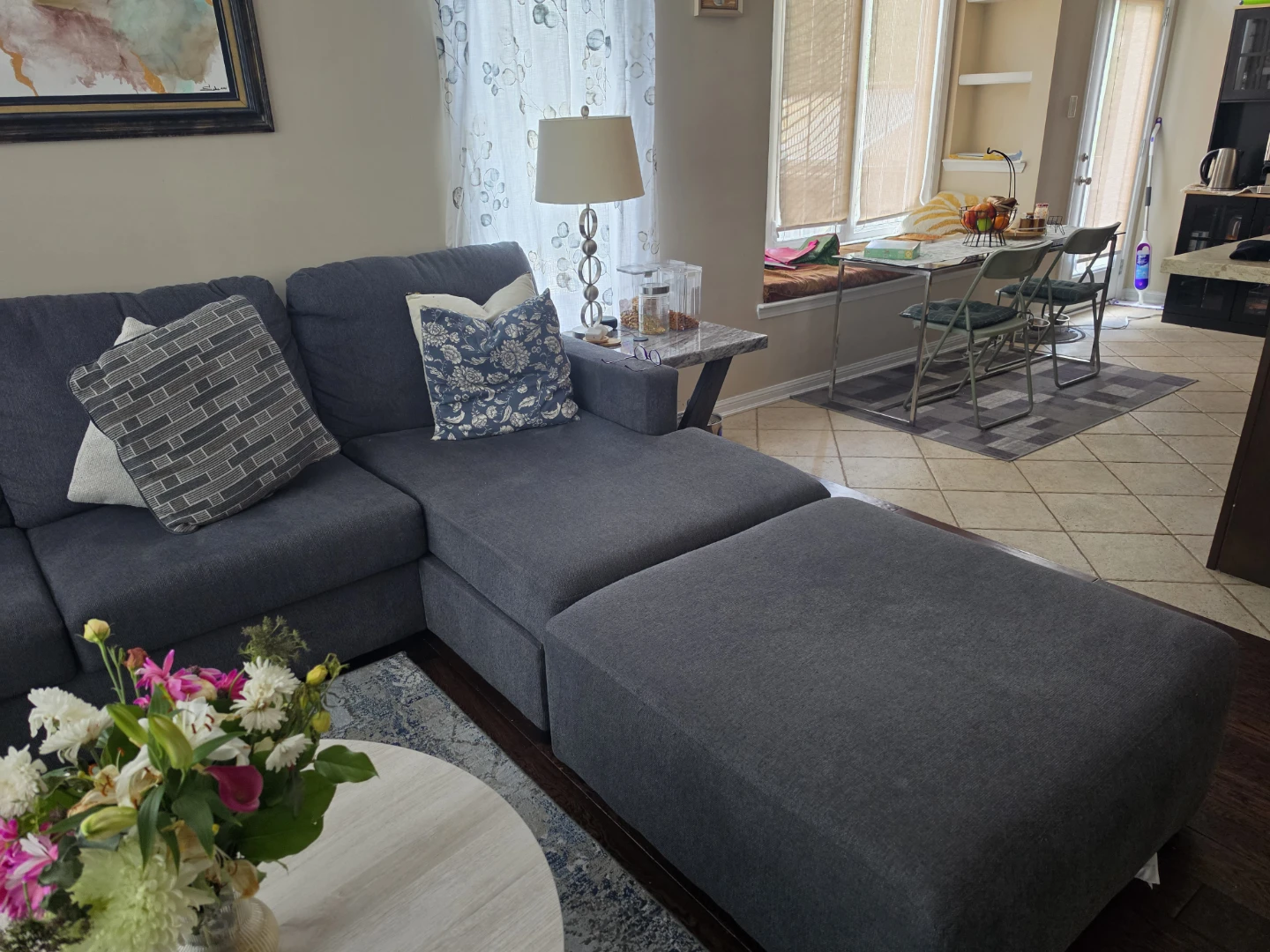 Dark Grey Sectional Sofa with Chaise and Ottoman.