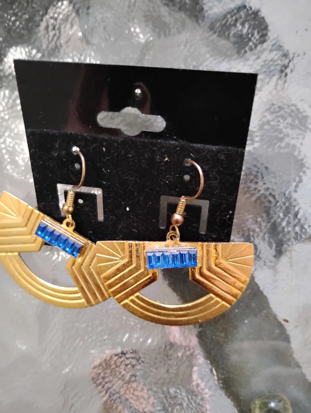 Gold tone Art Deco style earrings with blue accent