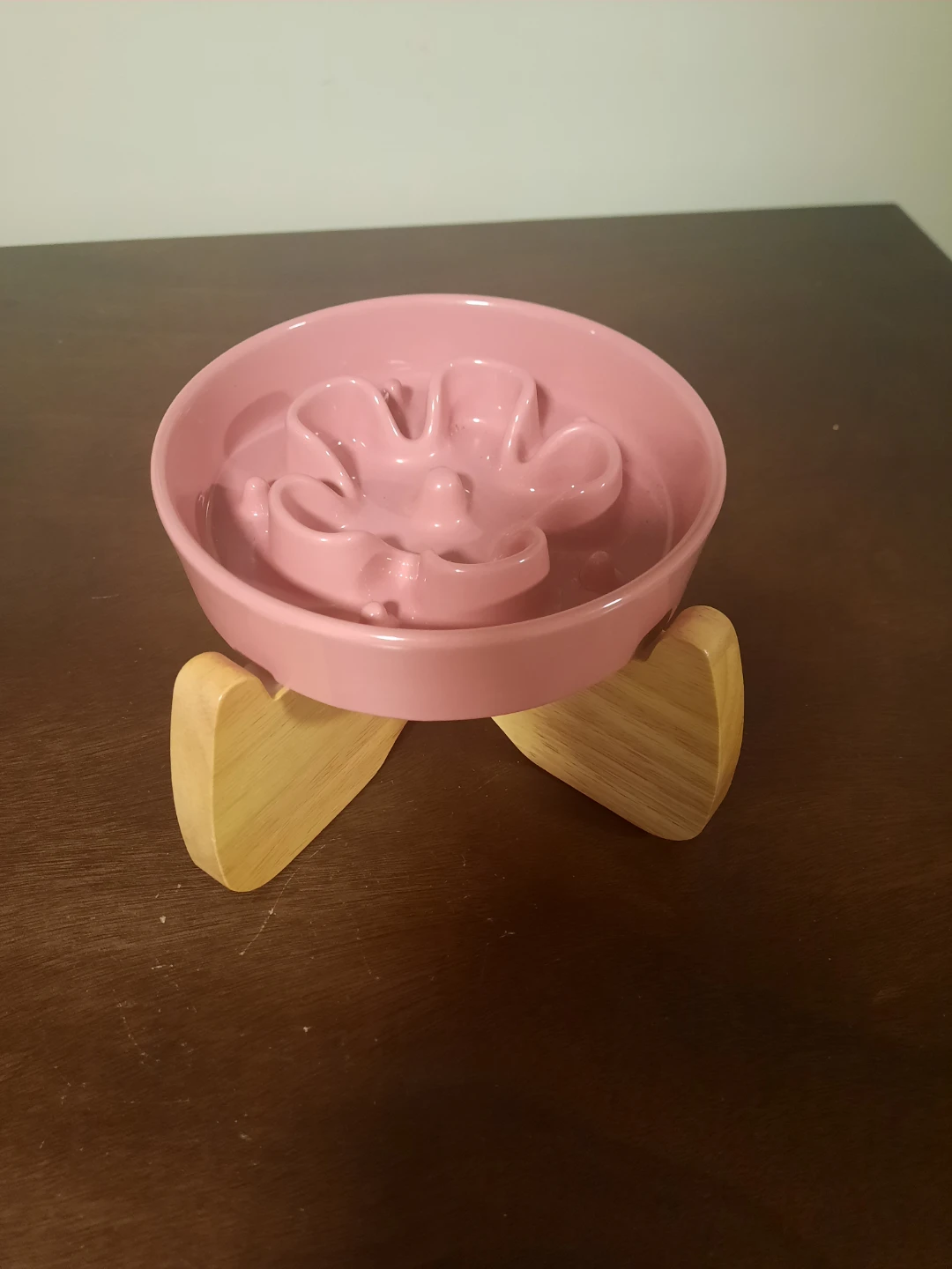 Pink slow feeder pet bowl with wooden stand