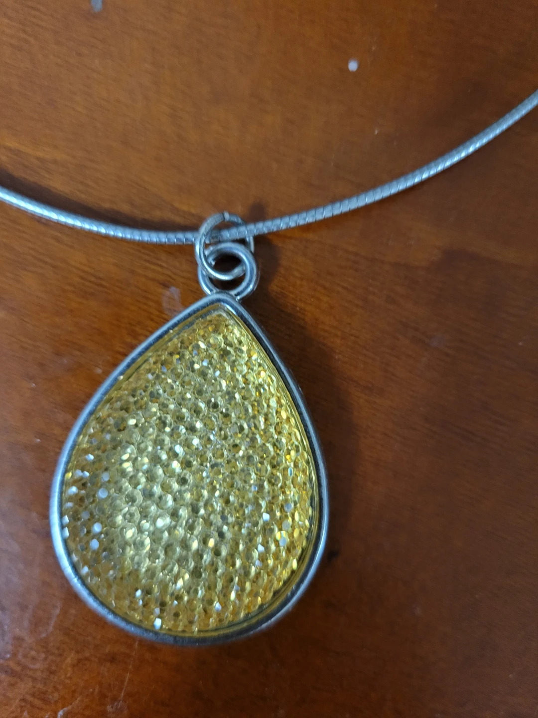 Silver-tone necklace with yellow glitter teardrop pendant