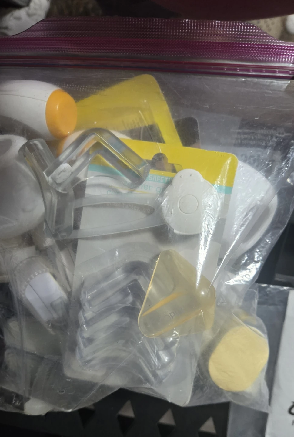 Zipploc bag full of Safety Corner Guards & Cabinet Locks
