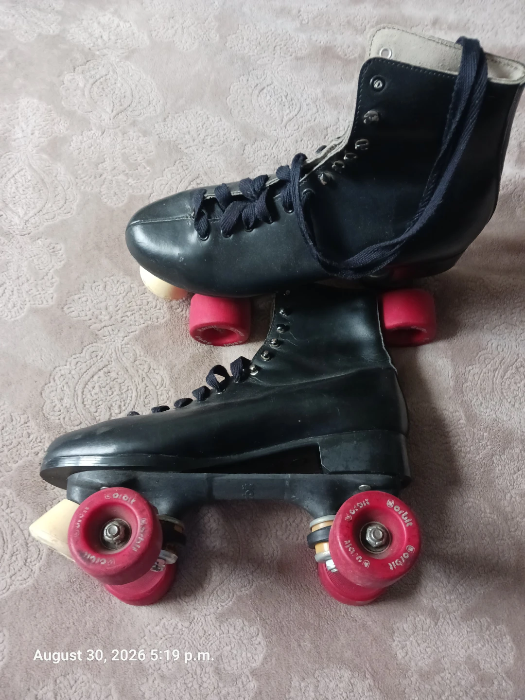 Used Black Roller Skates with Red Wheels