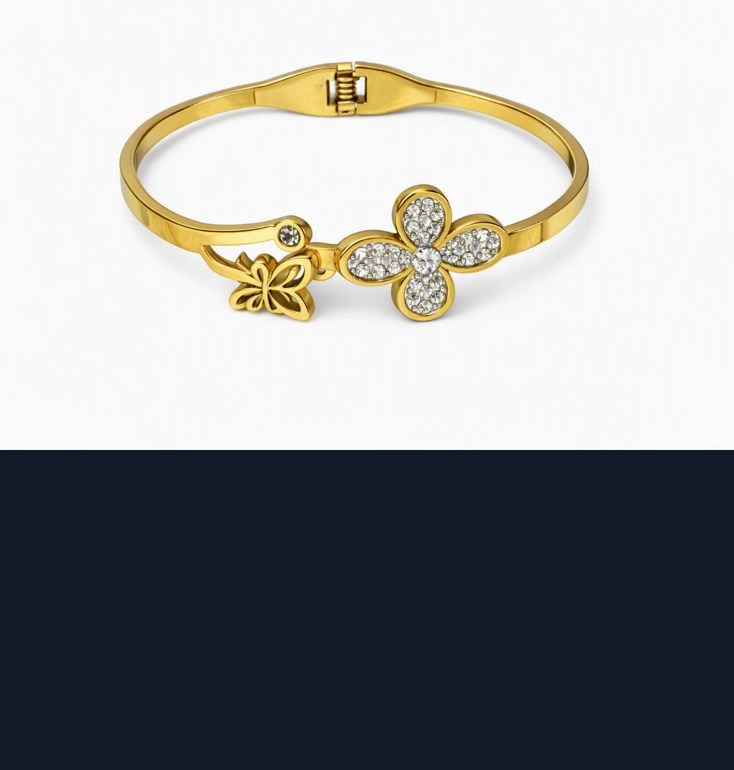 Gold-tone hinged bangle with butterfly and flower charm