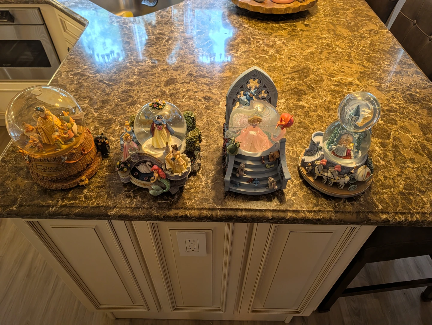 8 Disney Snow Globes.