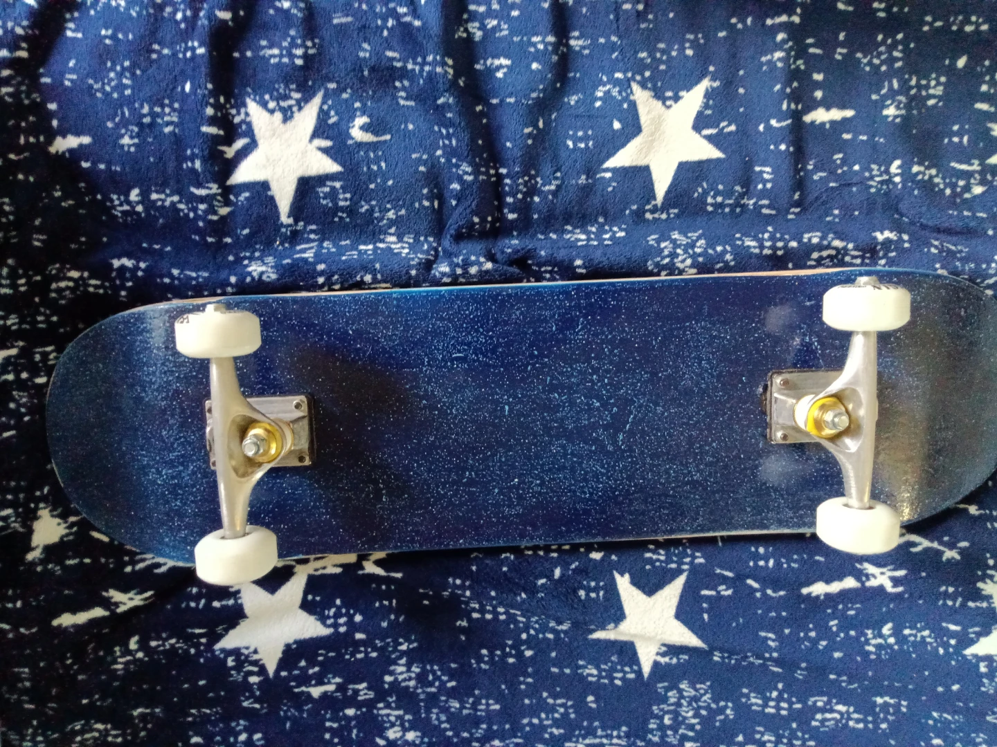 Blue Skateboard with White Wheels