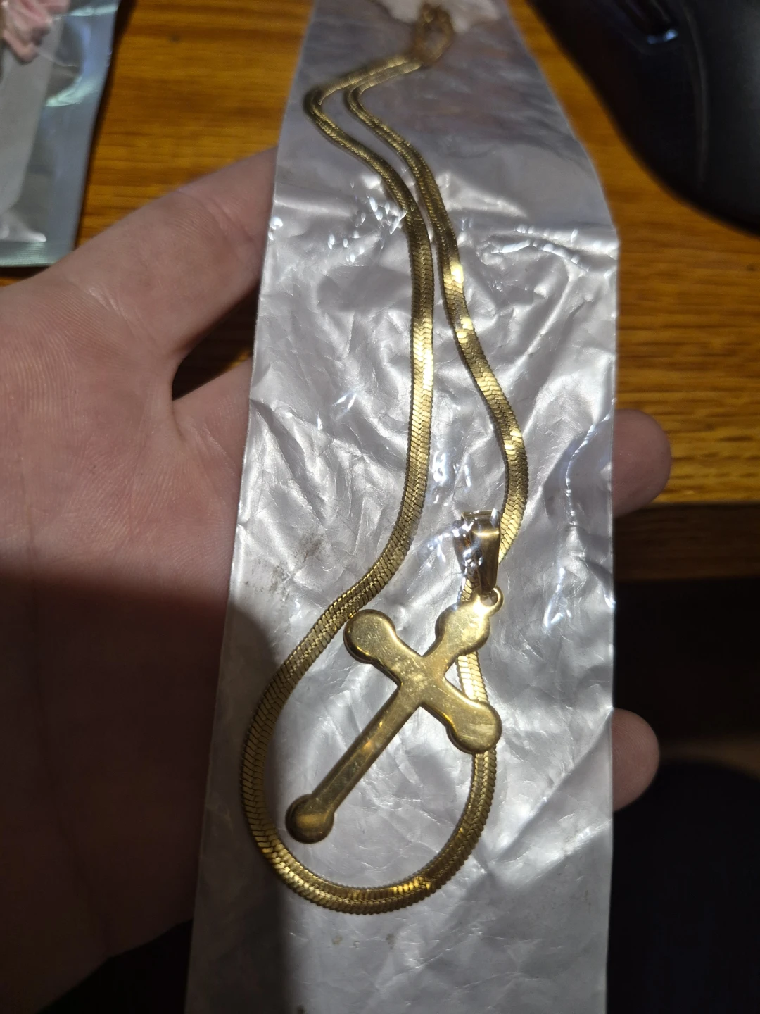 Gold coloured cross necklace