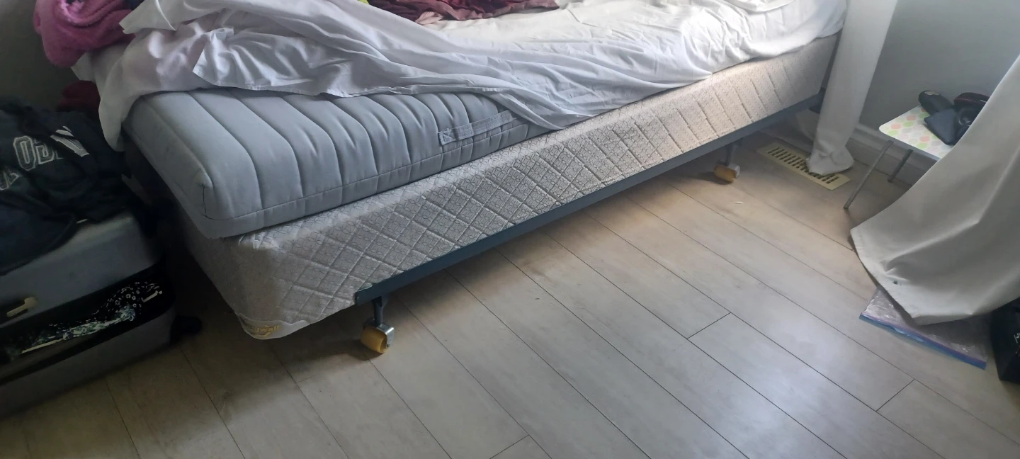 Metal bed frame , box spring and mattress.