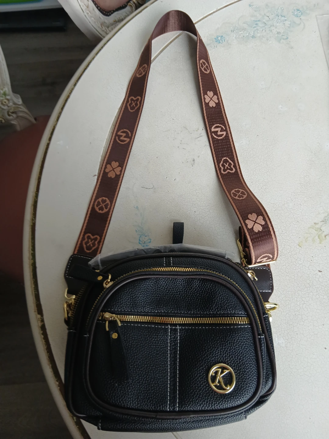 Black crossbody bag with logo strap