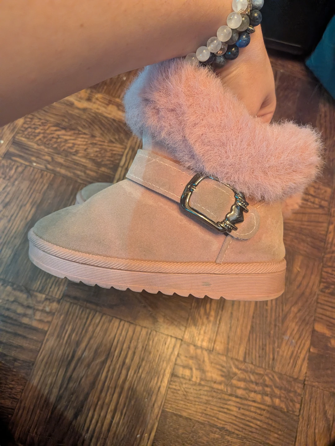 Pink faux suede boots with fur trim