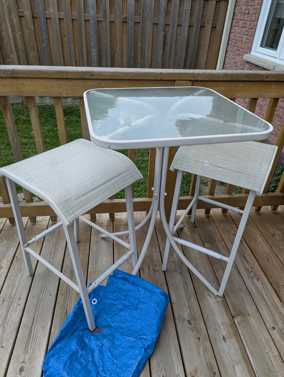 Outdoor bistro set with glass top table