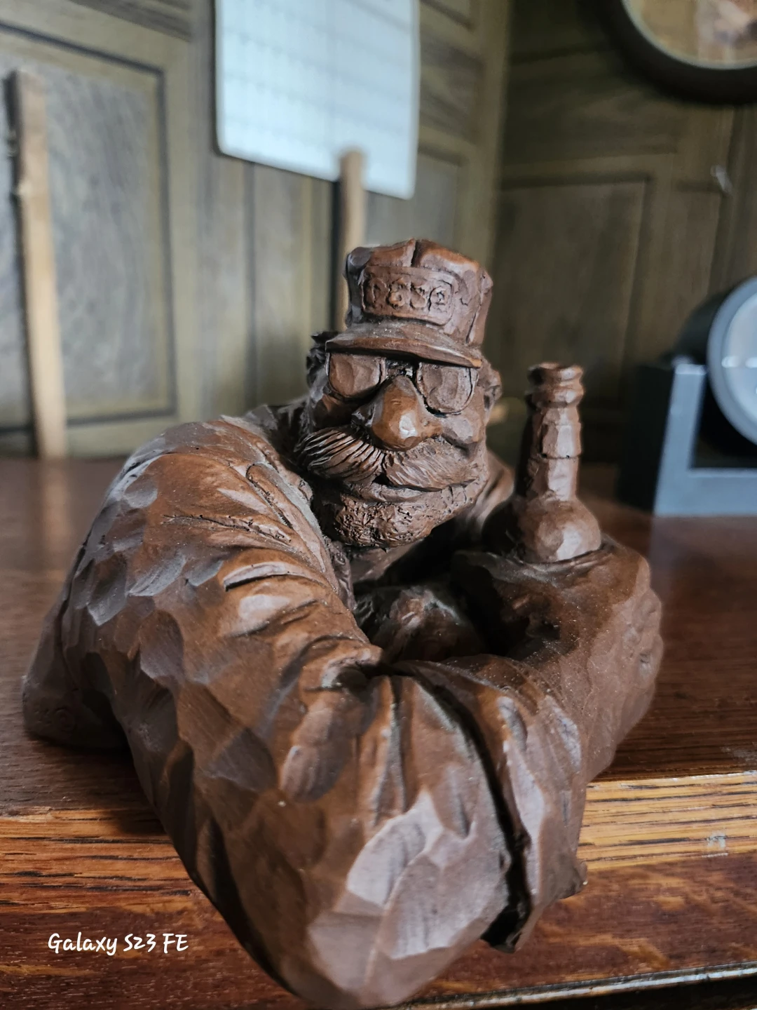 Hand Carved Wooden Figurine of a Man with a Hat and Bottle - photo 2
