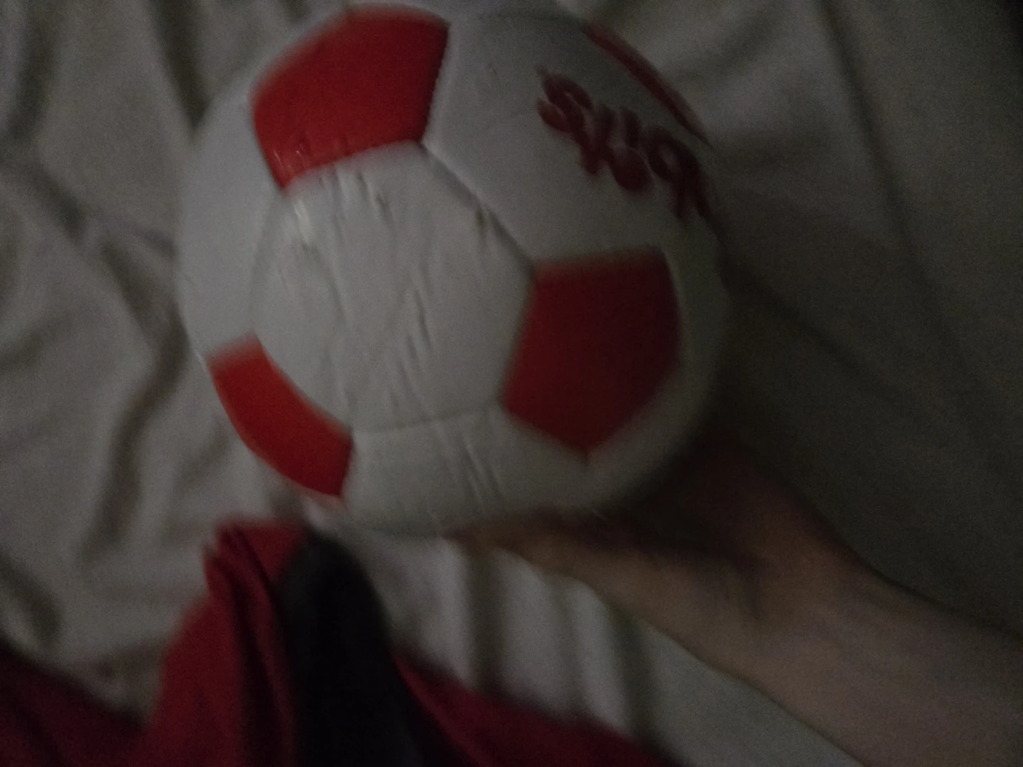 Red and white soccer ball