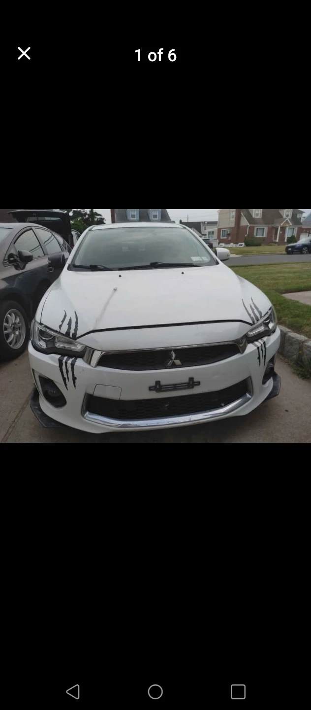 Pearlwhite Mitsubishi Lancer Es