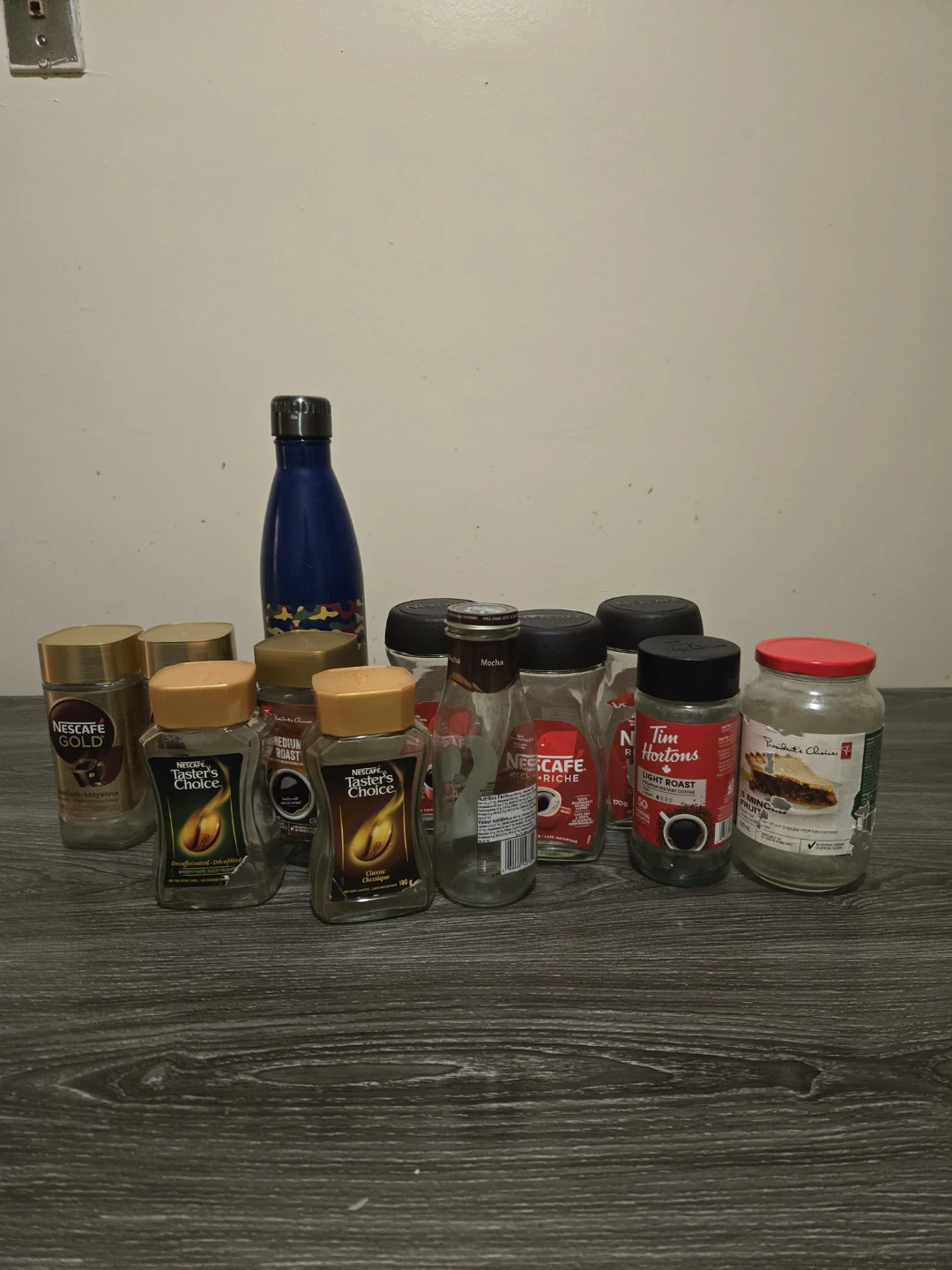 Assorted Empty Coffee Jars and Bottles