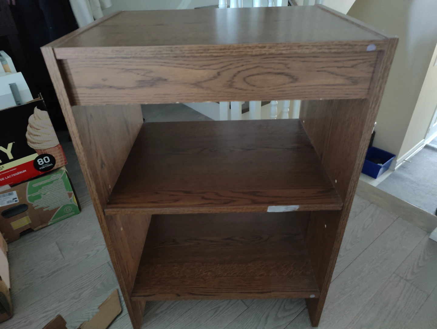 Wooden three tier shelving unit in oak finish