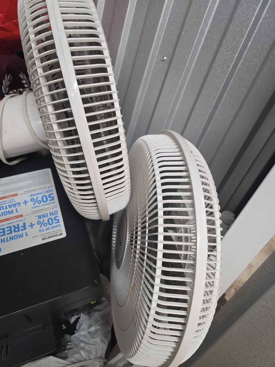 Two White Electric Fans