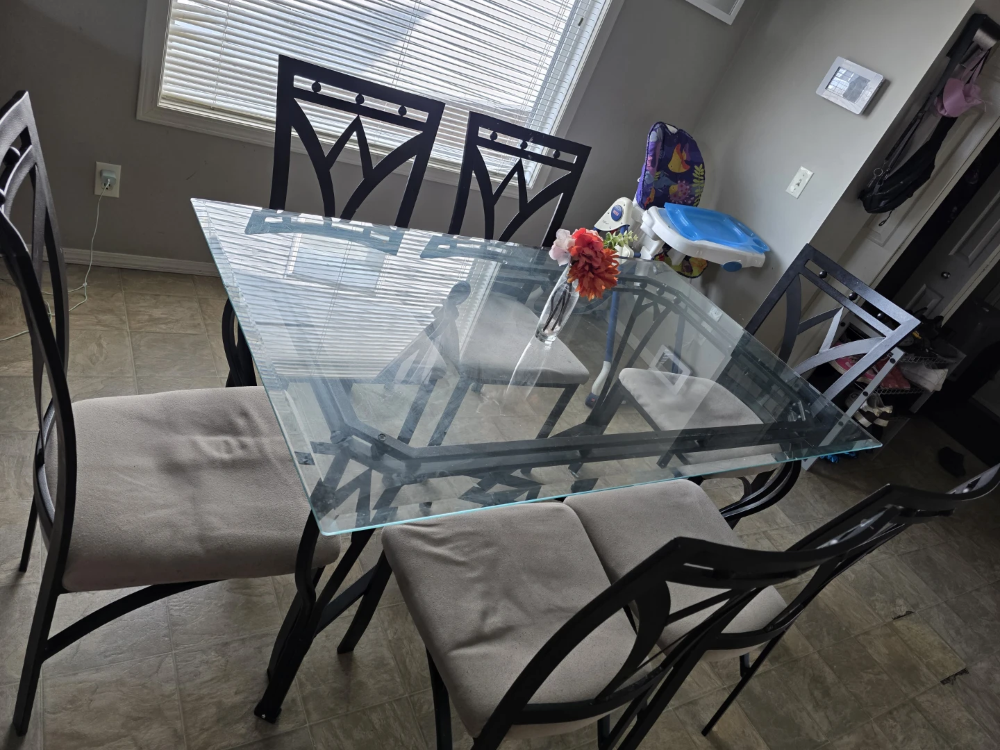 Glass table and six chairs for sale