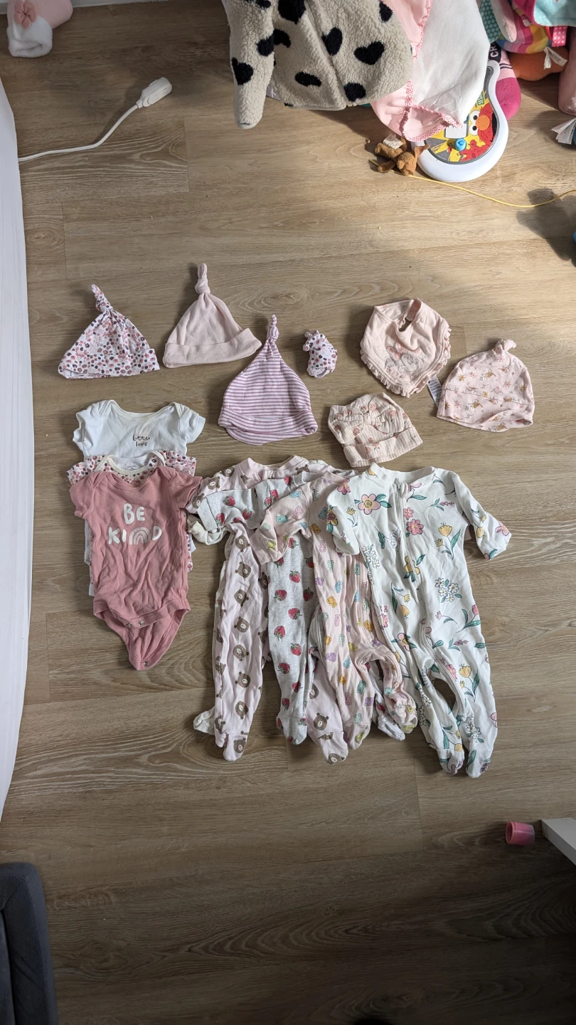 Baby girl sleepsuits and accessories bundle