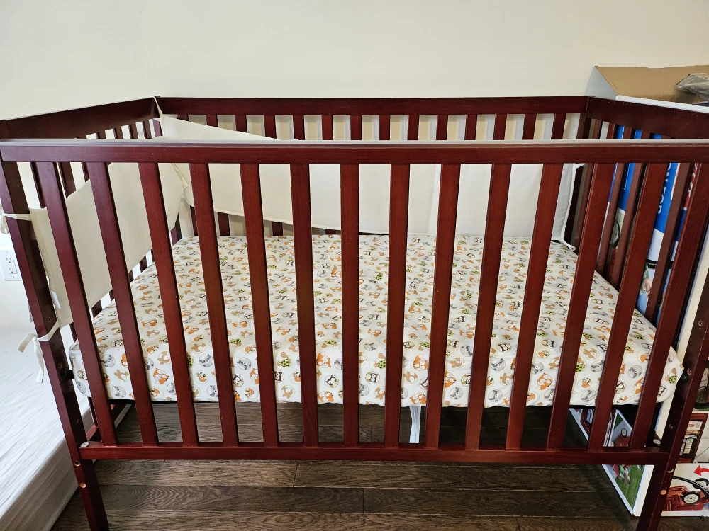 Baby Crib with Woodland Animal Sheet and Bumper Pads