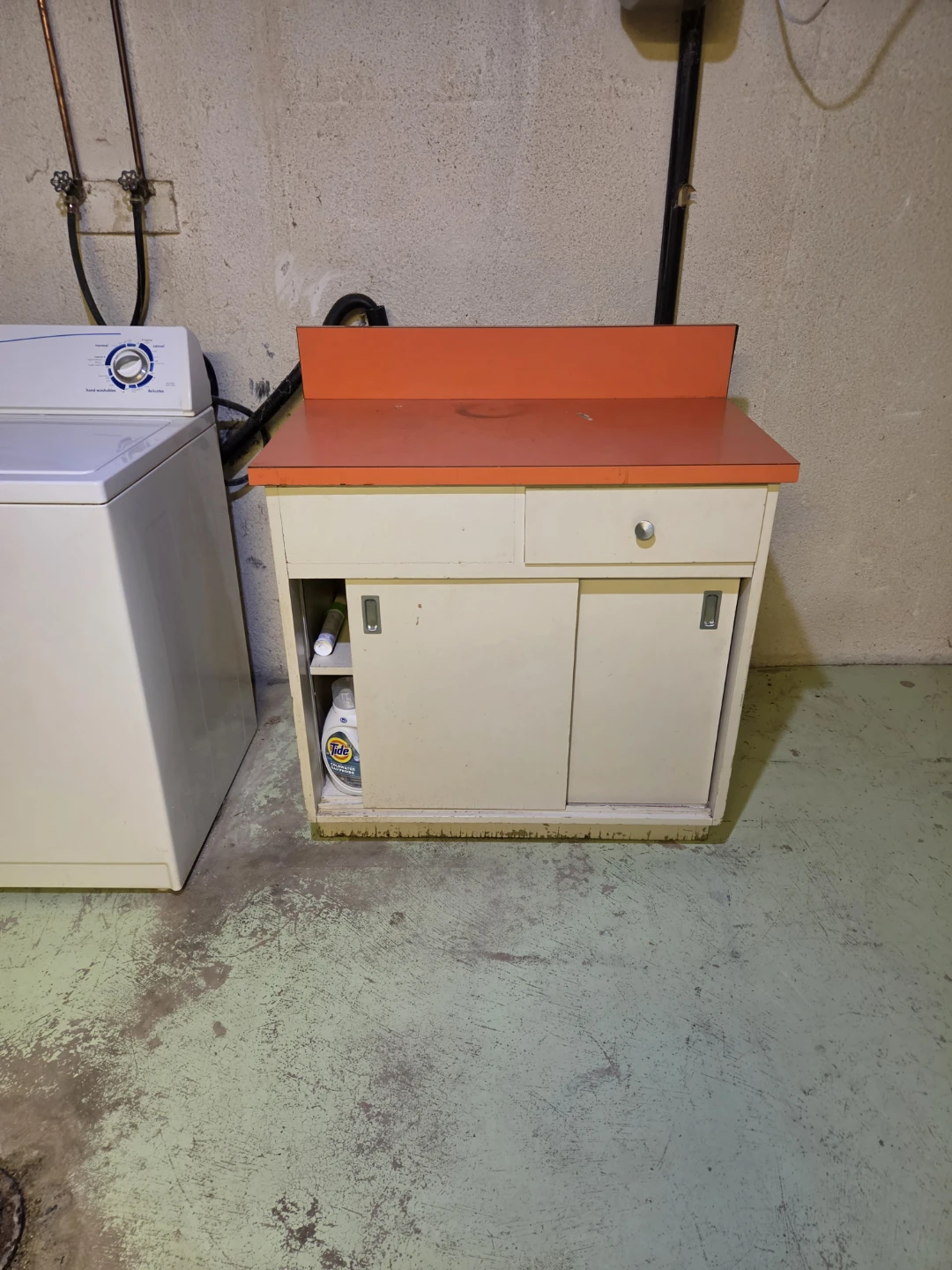 Vintage Laundry Cabinet with Orange Countertop