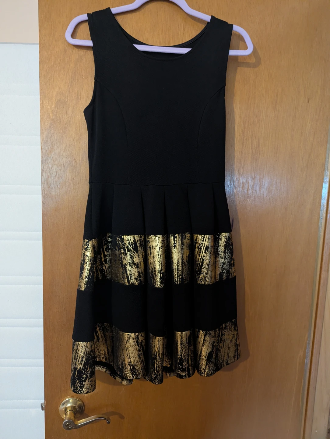 Black dress with gold metallic stripes