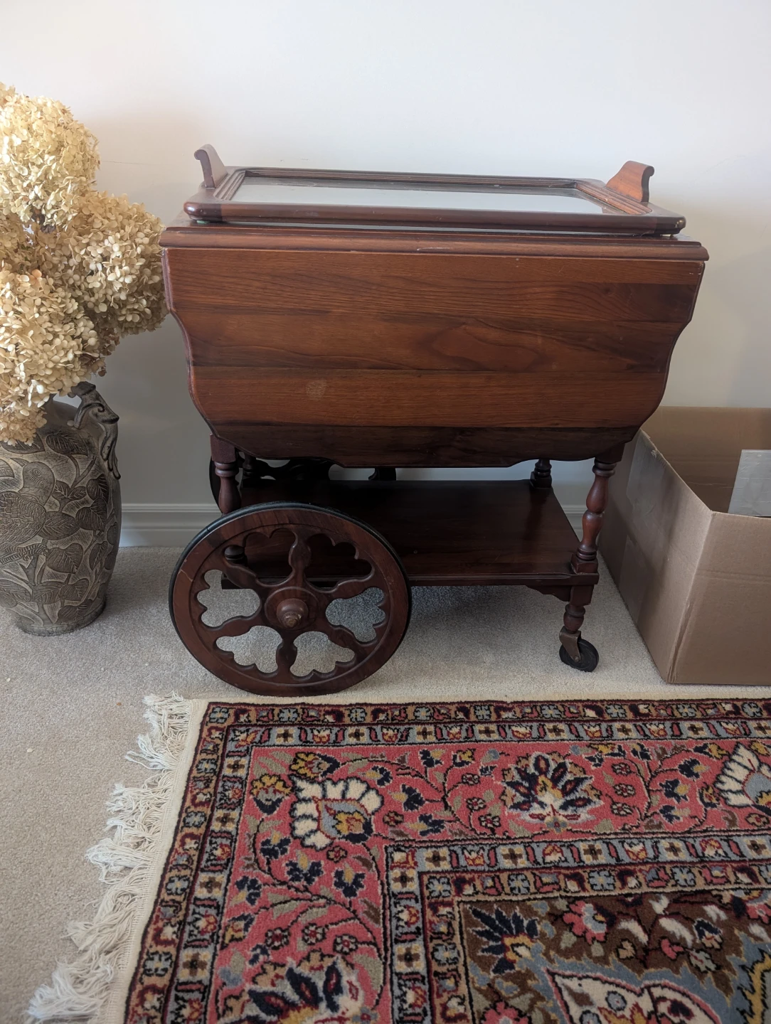 Antique wooden tea cart with glass top
