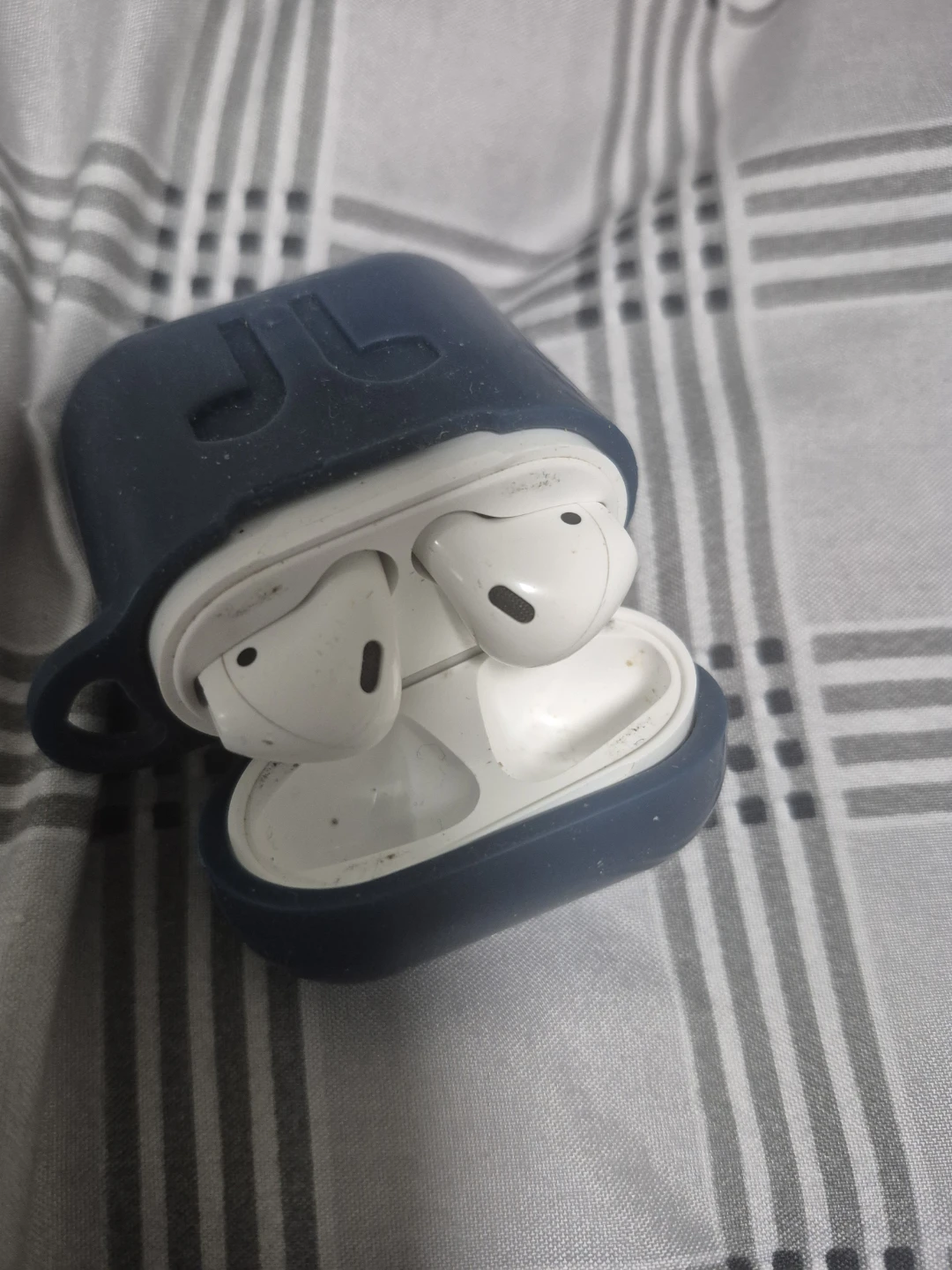 White Earbuds with Blue Protective Case
