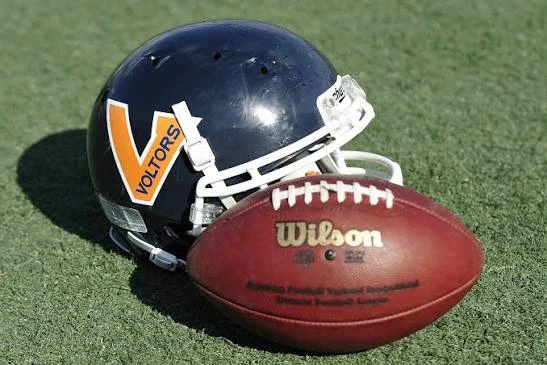 Wilson Football and Voltors Helmet