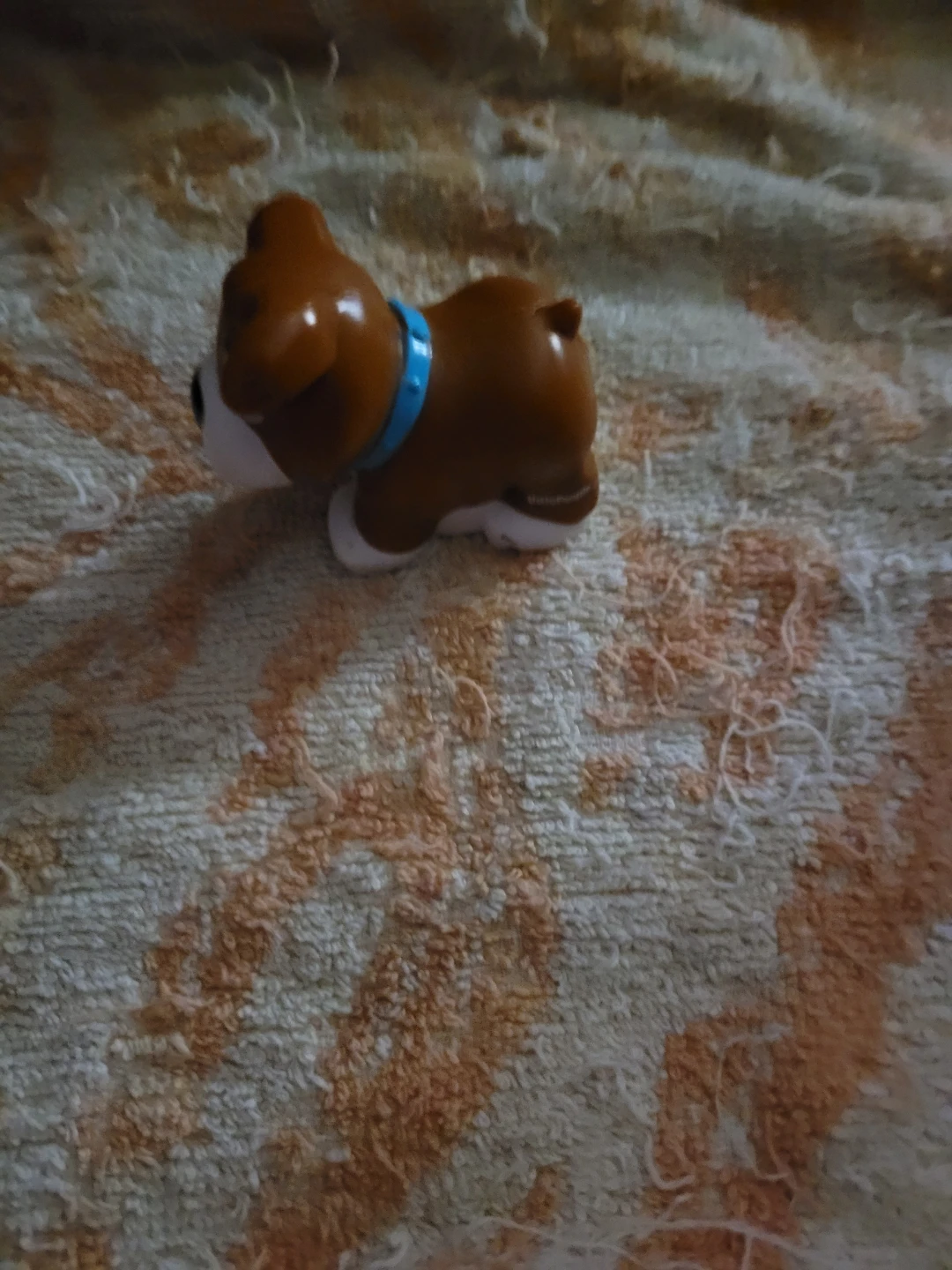 brown and white dog figure from the Fisher-Price