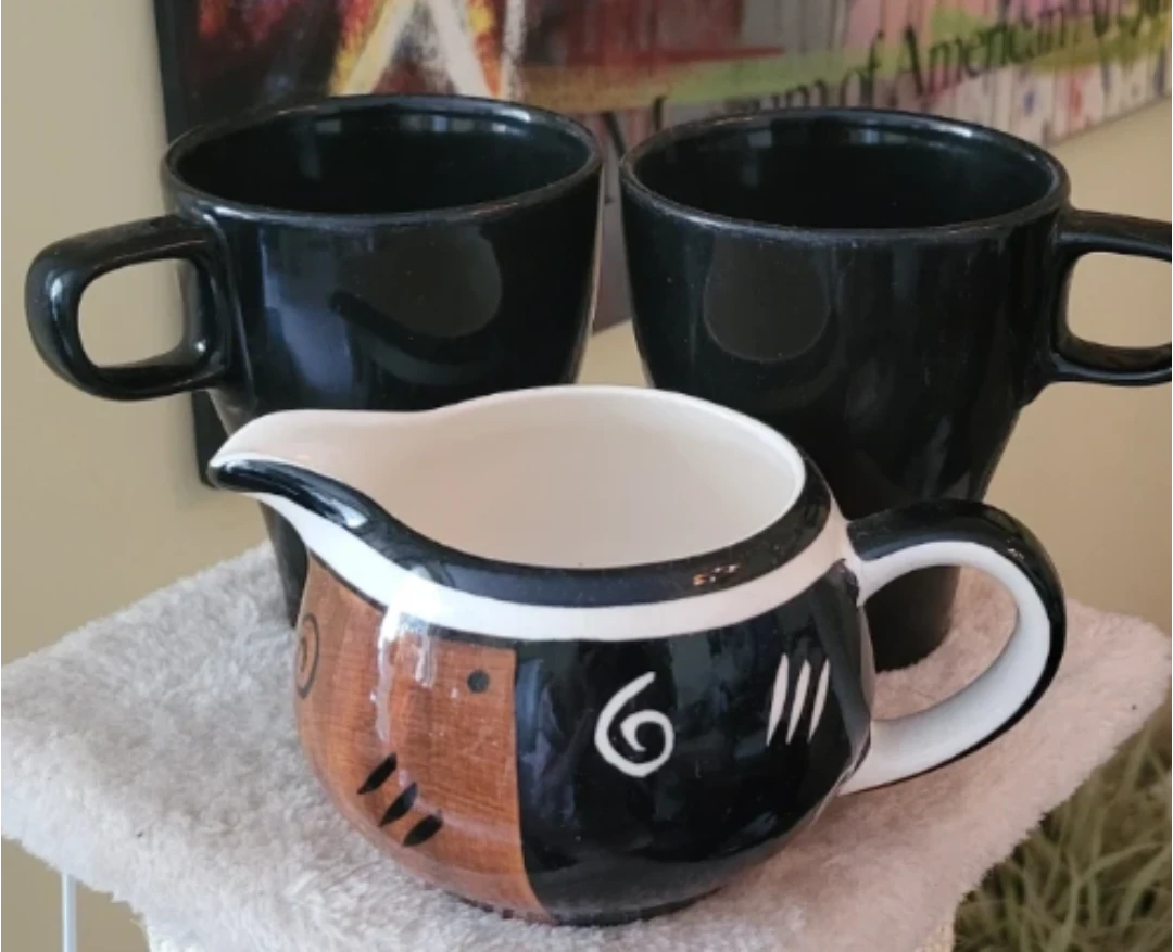 2 Black Mugs and Creamer Pitcher