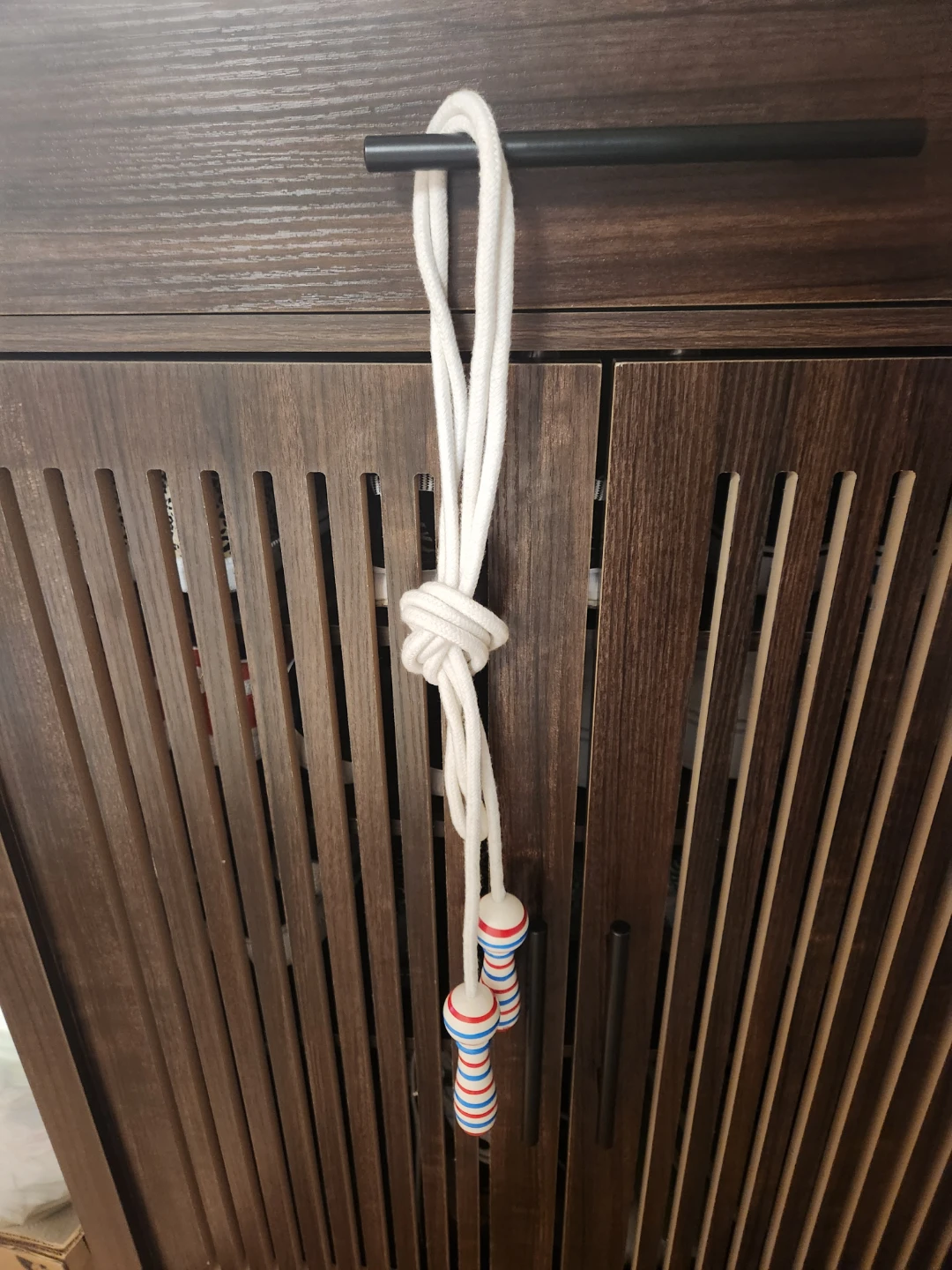 White Jump Rope with Red and Blue Striped Handles