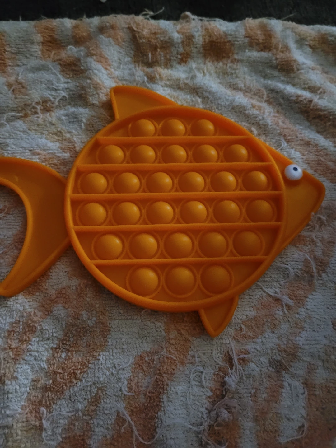 Orange fish fidget pop it toy