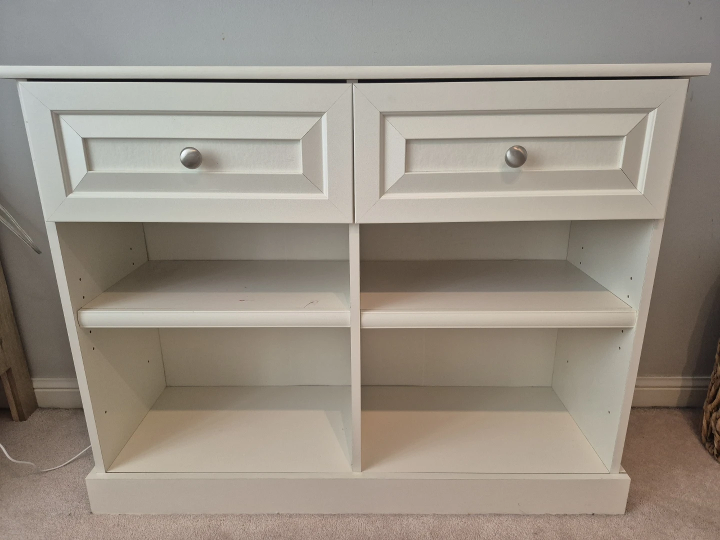 White storage cabinet with drawers and shelves