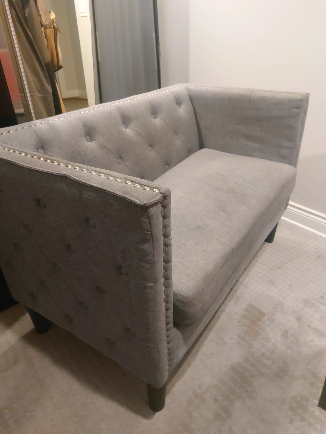 Grey Tufted Loveseat with Silver Studs