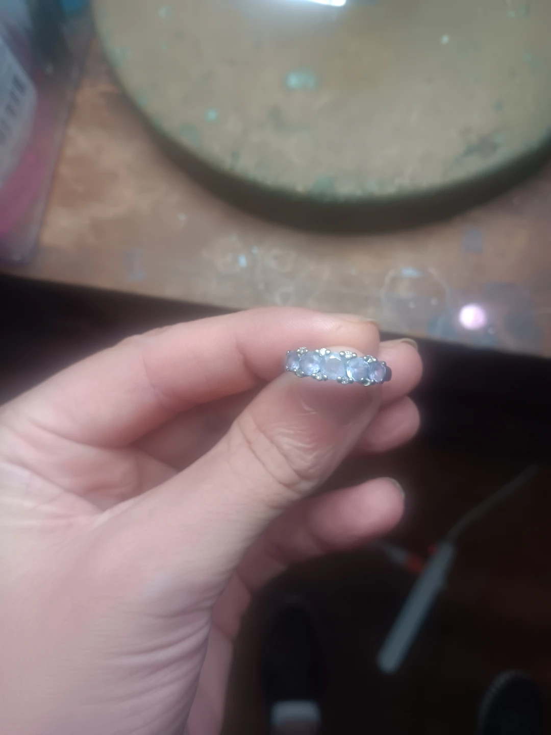 Silver band ring with light blue stones