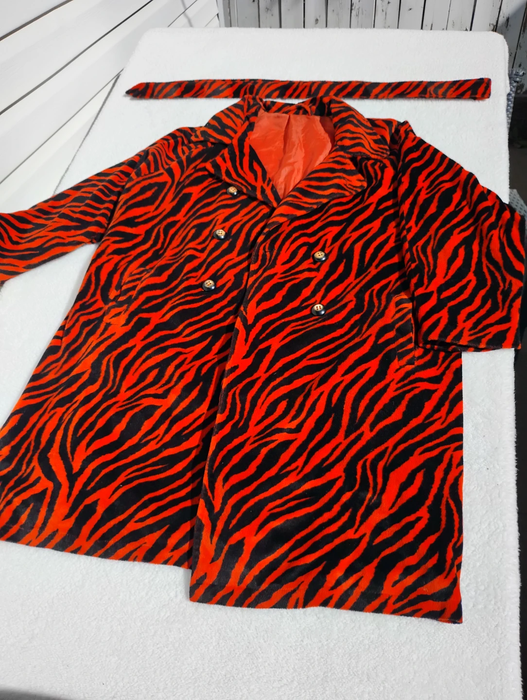 Orange and black zebra print trench coat