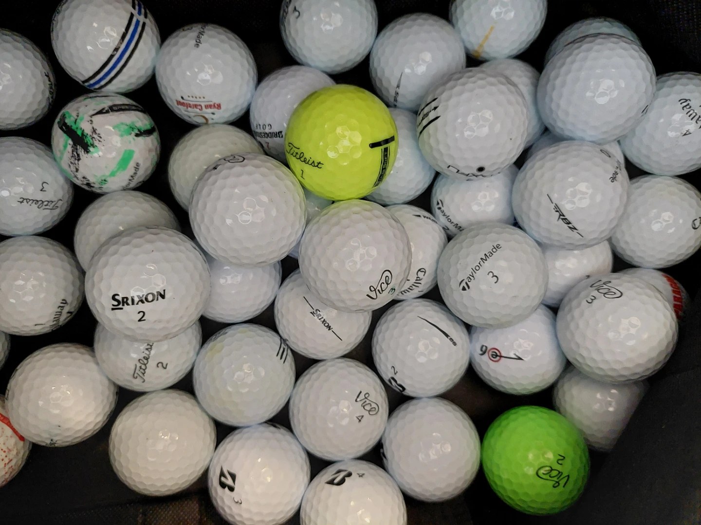 Assortment of 50 Golf Balls - Titleist, Callaway, TaylorMade