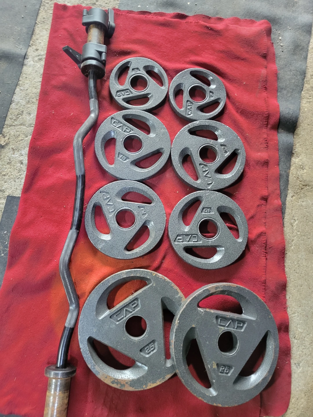 CAPS  85LBSs OLYMPIC PLATES  2-25s  4-10s  2-5s  EZ-CURL BAR