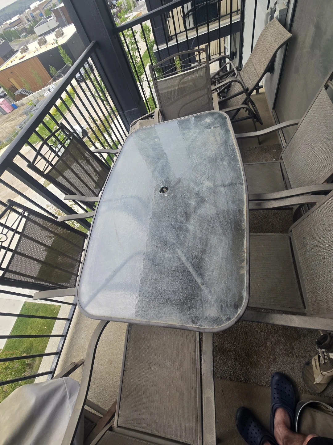 Glass top patio table with 6 chairs