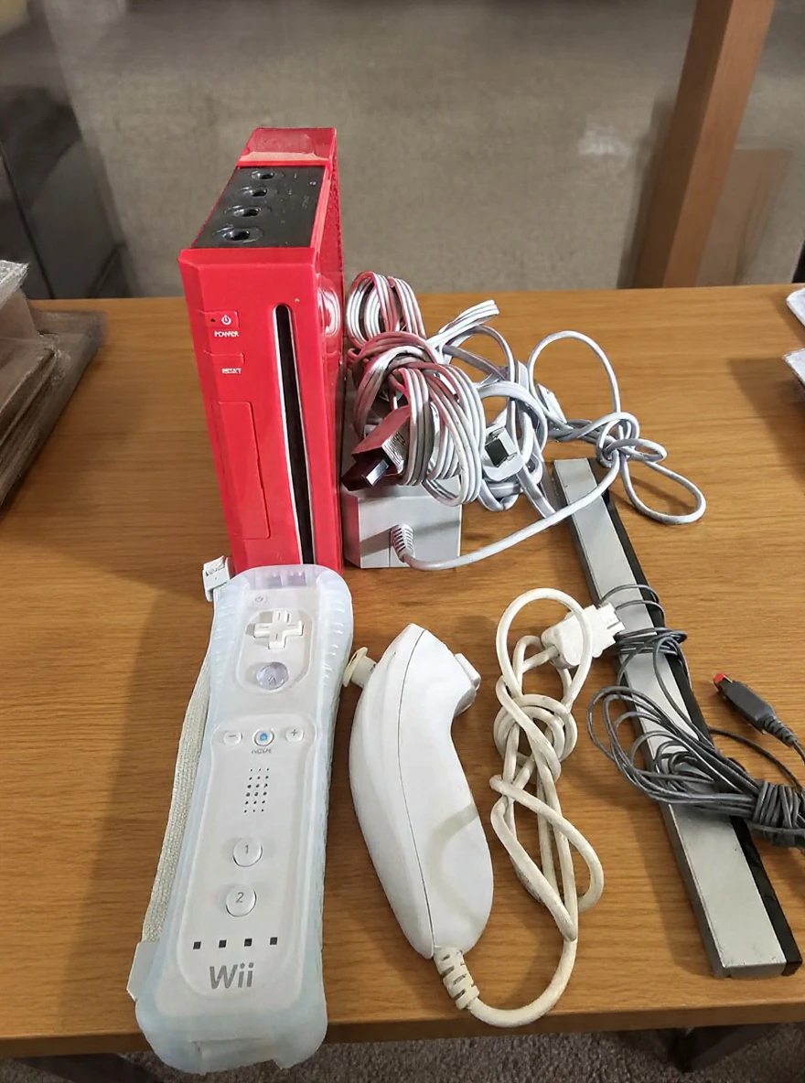 Red Nintendo Wii Console with Controllers and Cables