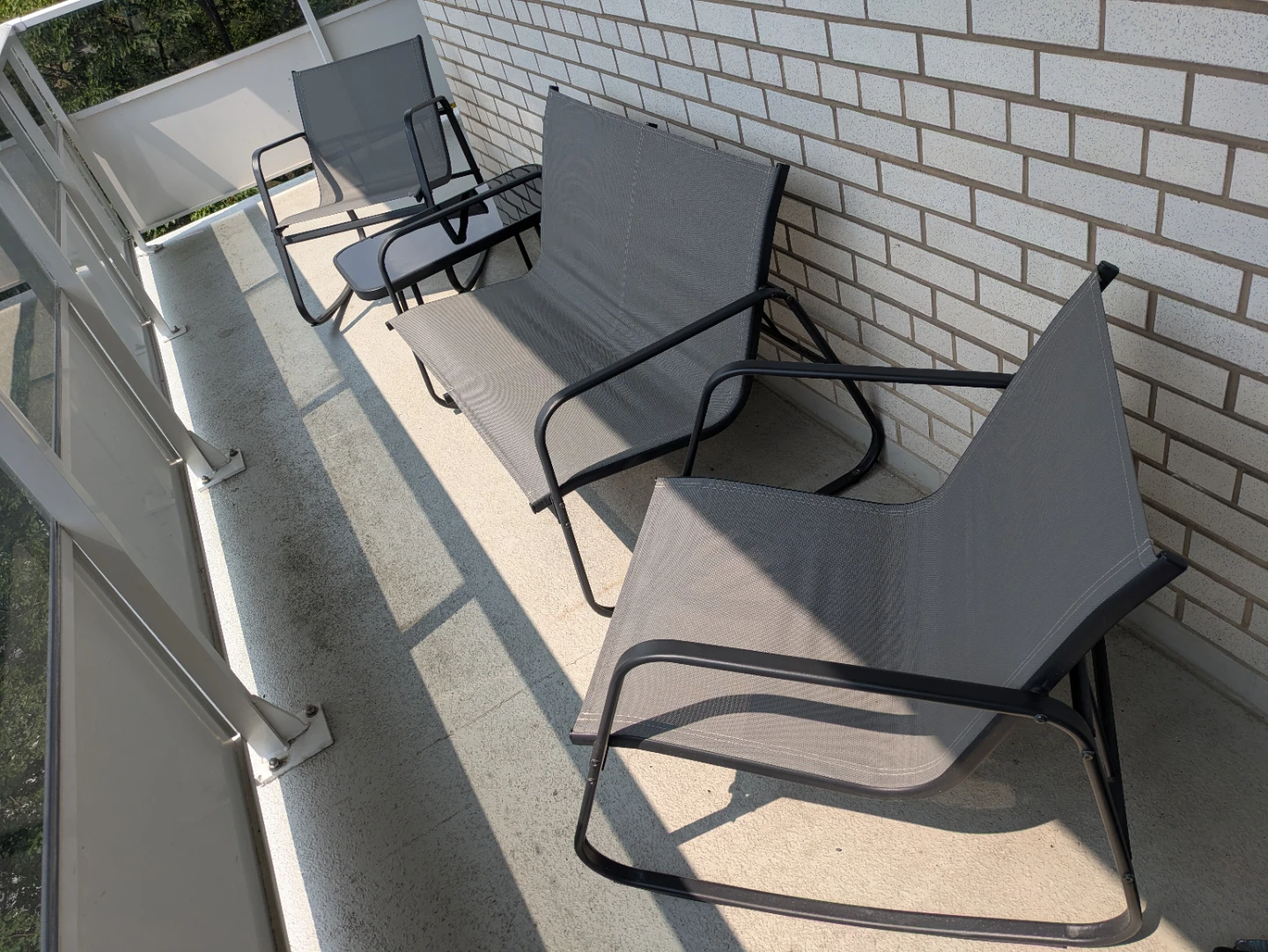 Like-New 4-Piece Patio Rocking Set with Glass Table - photo 3
