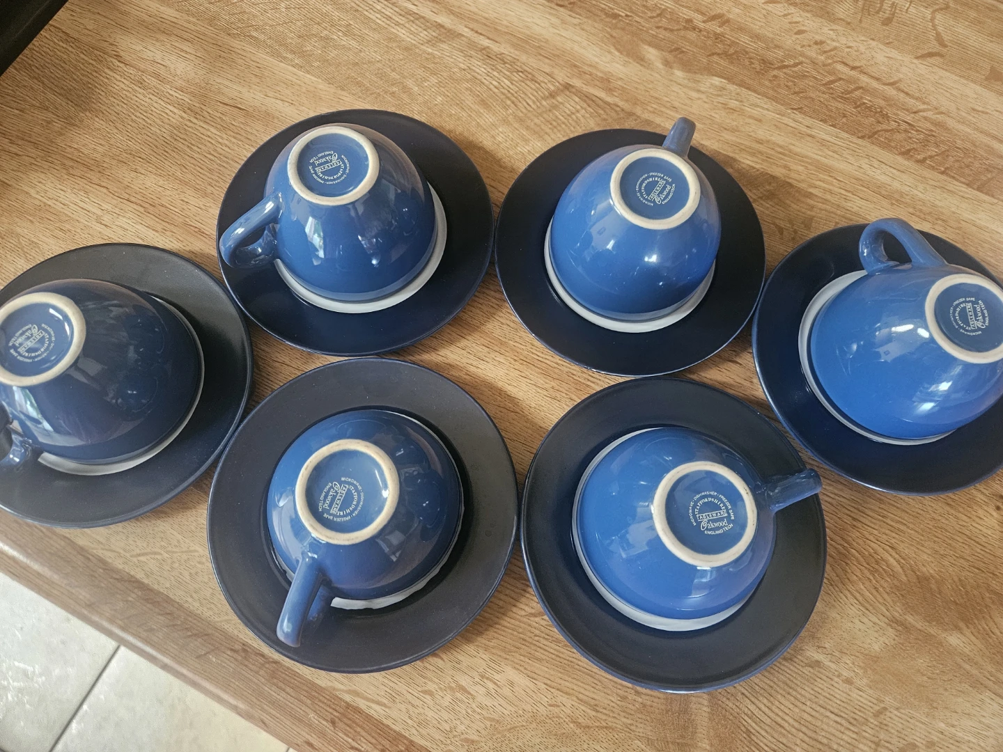 Set of 6 blue stoneware coffee cups and saucers