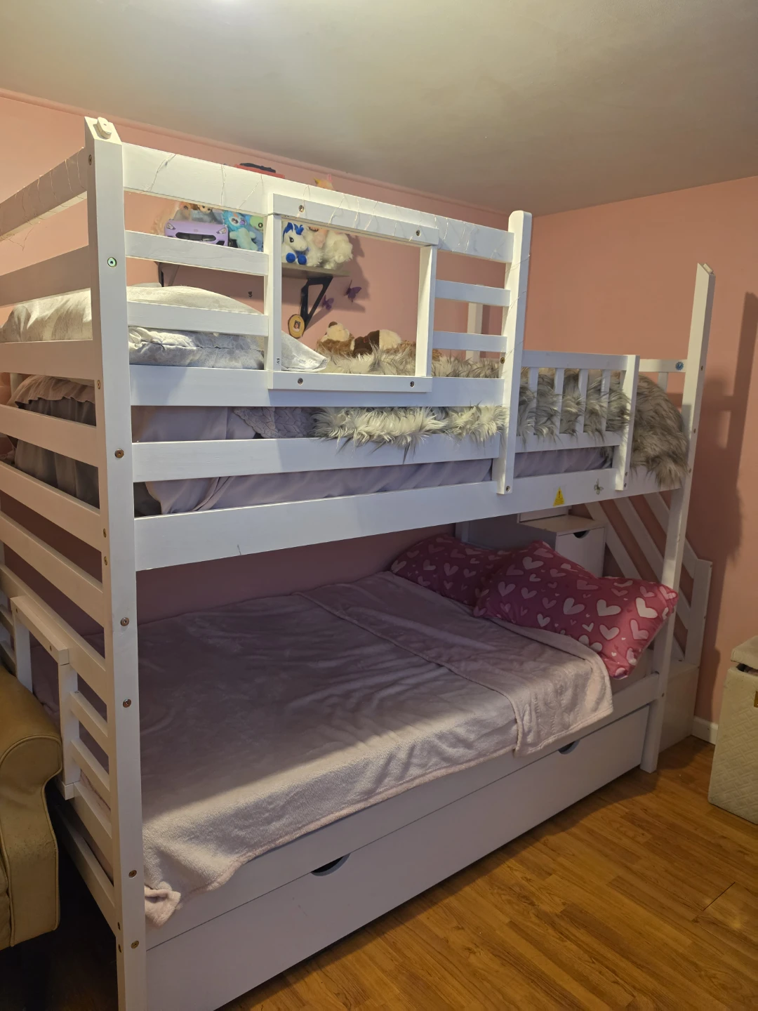 white bunk bed with a slide